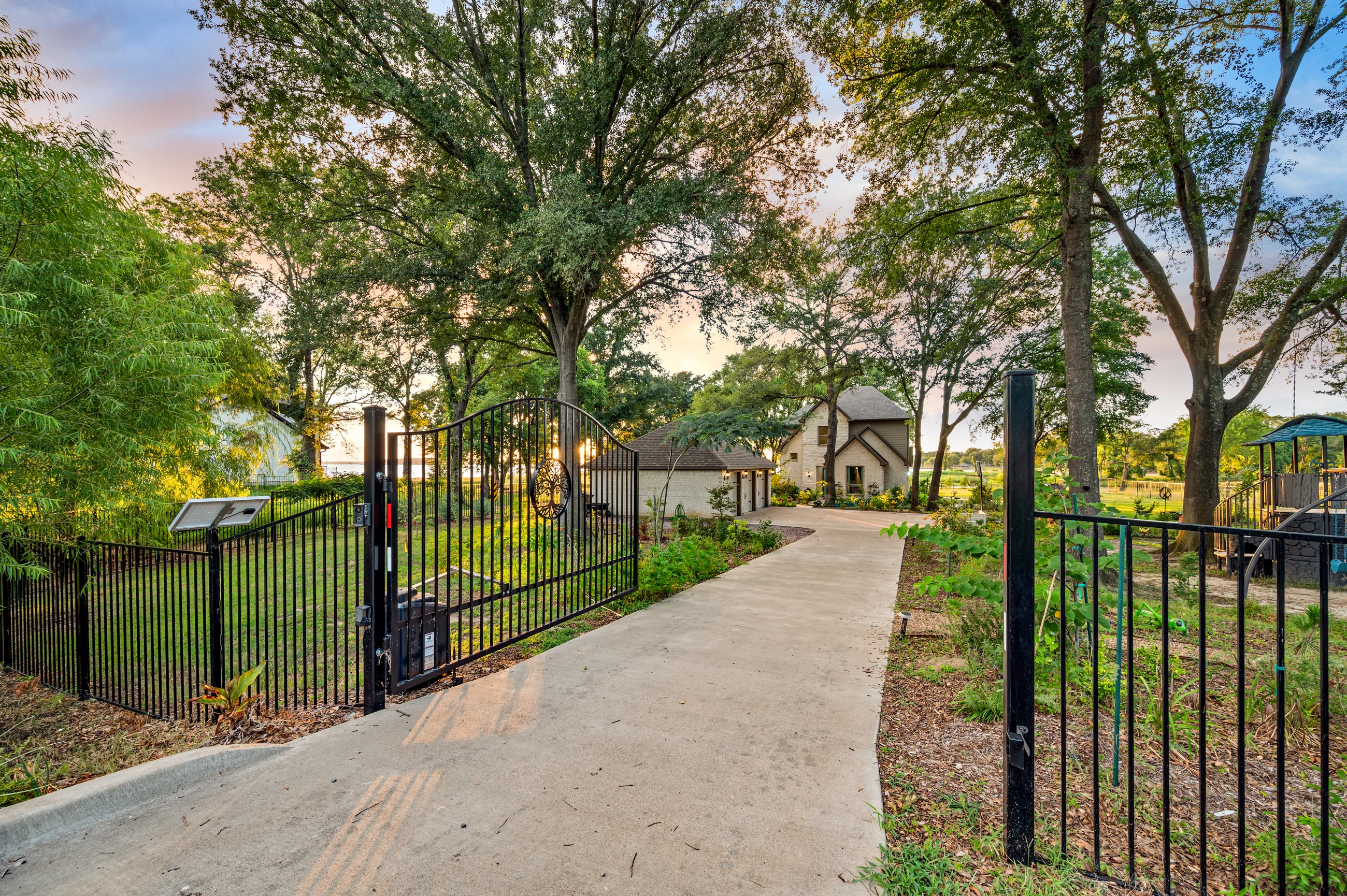 Private drive and garden path beneath mature trees