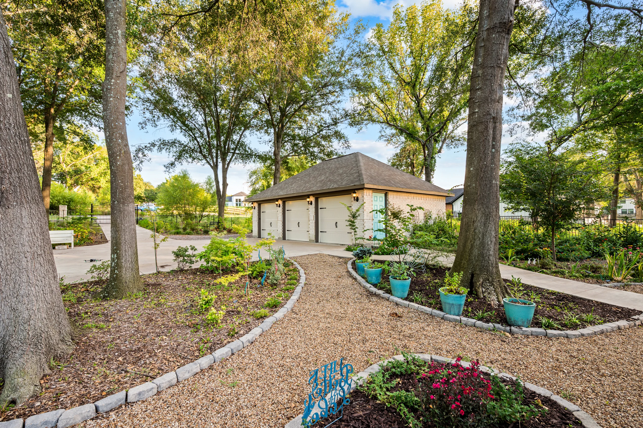 Garden court and open space between the home and mature trees