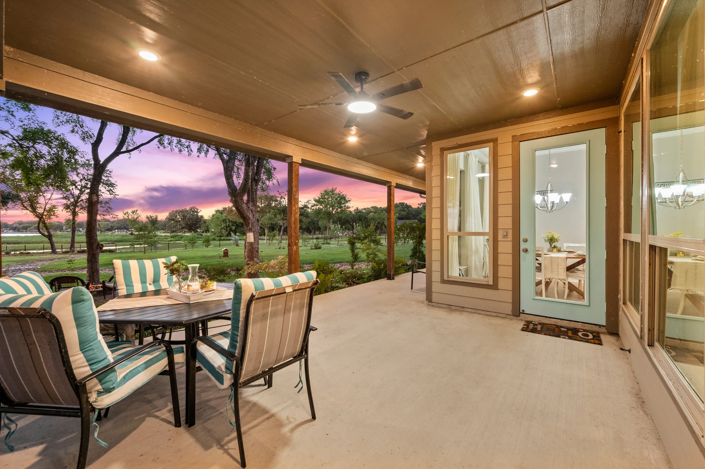 Covered porch at sunset at a Cedar Creek Lake waterfront home