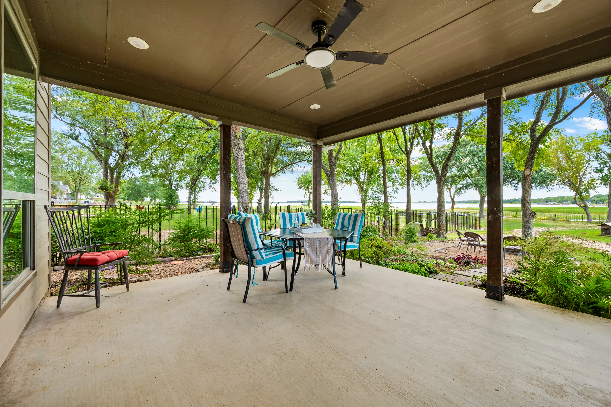 Covered porch overlooking the gardens and Cedar Creek Lake