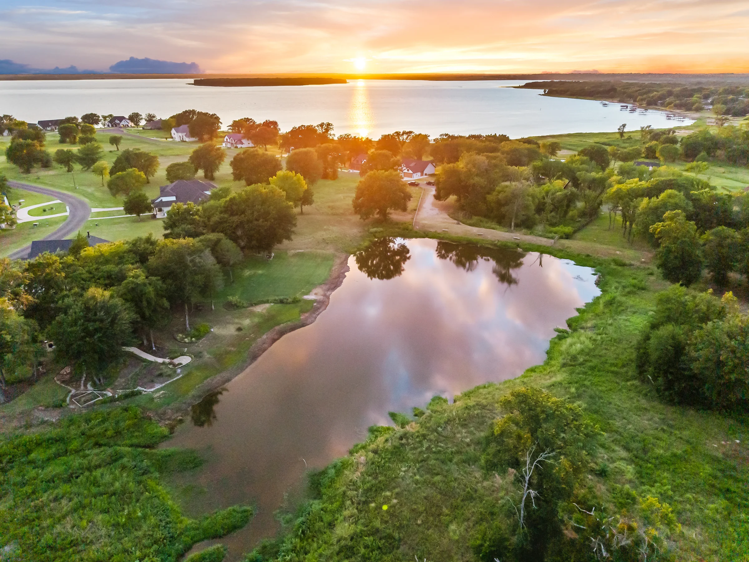 Aerial sunset over Cedar Creek Lake and the nearby island